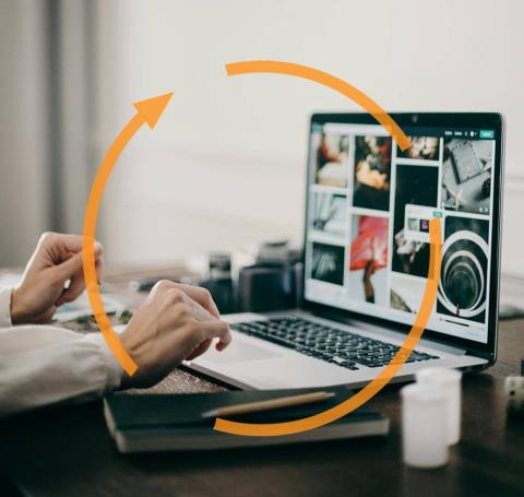 A person working on a laptop with an update status icon overlayed